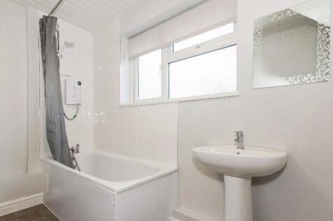 This well-maintained bathroom features a clean ...