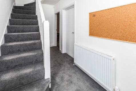 A well-maintained staircase featuring soft carp...
