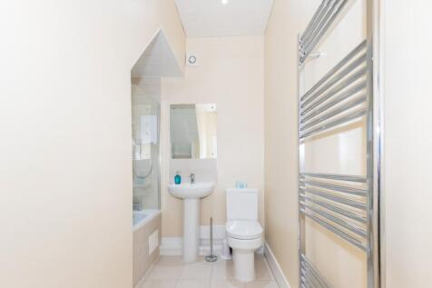 A modern and stylish bathroom featuring a sleek...