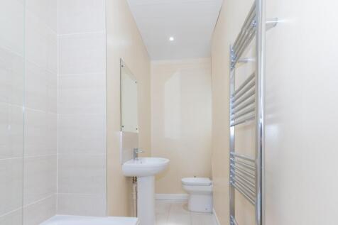 A modern bathroom featuring a sleek design with...