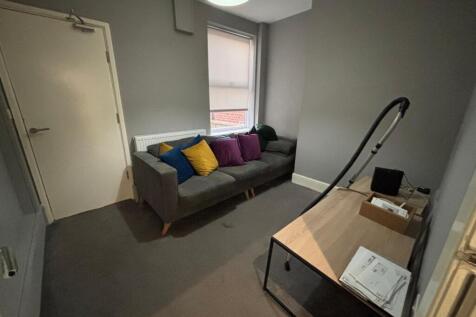 This cozy living room features a comfortable so...