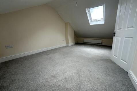 Bright and spacious double bedroom featuring a ...