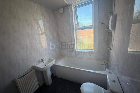 Bright and spacious bathroom featuring a modern...