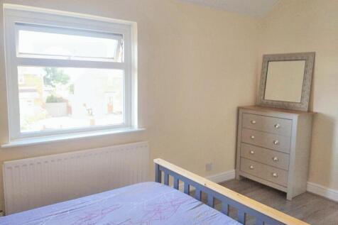 Bright and welcoming master bedroom featuring a...