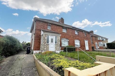 A charming brick terraced house with a neat fro...