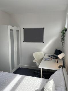 Experience a cozy double bedroom, featuring amp...