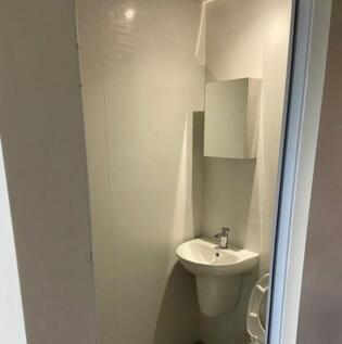 A tidy single toilet with modern fixtures, perf...