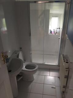 A well-maintained bathroom featuring a modern s...
