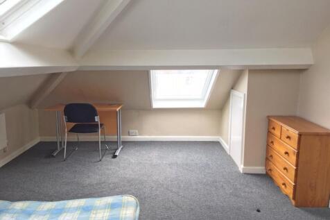 This spacious double bedroom features ample nat...