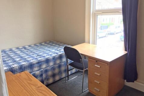 Cozy double bedroom featuring a comfortable bed...