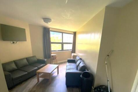 A bright and inviting living room with modern f...