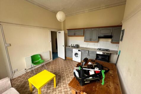 A functional kitchenette with ample space for d...