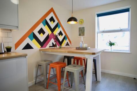 A vibrant kitchen featuring a modern design wit...