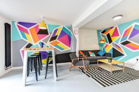 This vibrant living room features stylish decor...