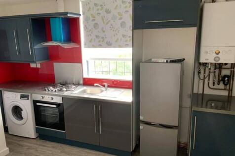 A modern kitchen with ample storage and applian...