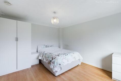 This charming double bedroom features a cozy la...