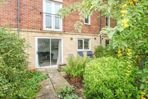 A charming garden area featuring lush greenery ...