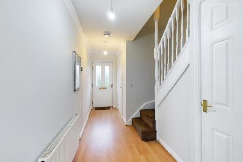 Bright and welcoming hallway featuring modern d...