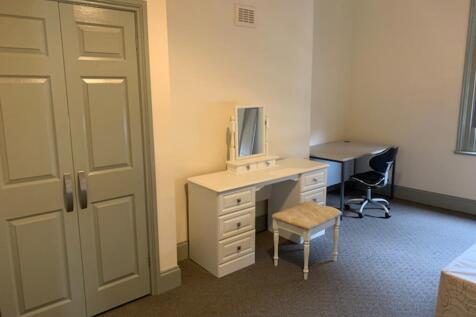 A bright and tidy double bedroom featuring a sp...
