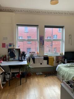 Bright and cozy double bedroom featuring large ...