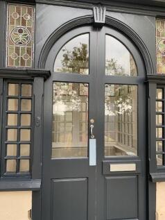 Elegant front door of a terraced house featurin...