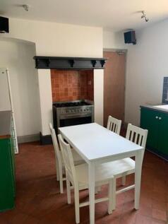 A bright and inviting kitchenette with modern a...