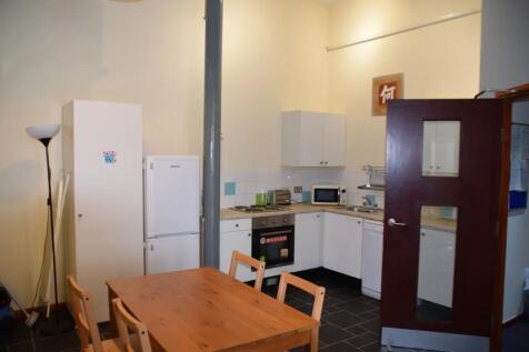 A spacious and clean kitchenette with modern ap...
