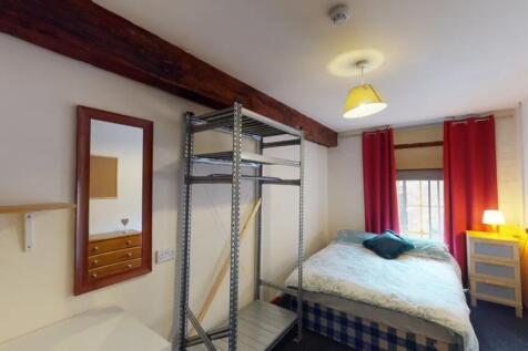 A bright and inviting double bedroom featuring ...