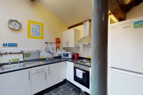 A bright and tidy kitchenette featuring modern ...