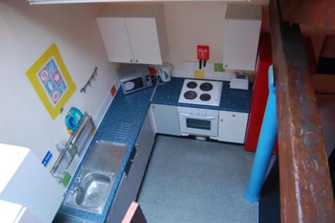A bright and functional kitchenette with modern...