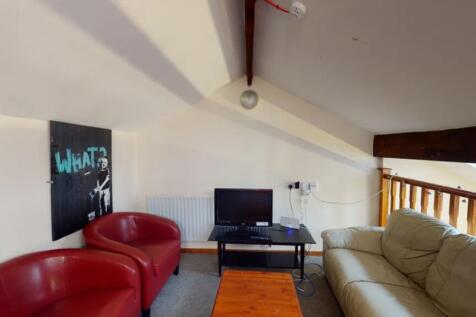A cozy and inviting living room featuring comfo...