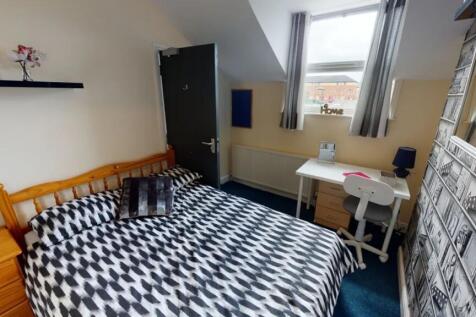 A bright and inviting double bedroom featuring ...