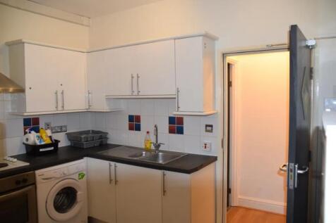 A tidy and functional kitchenette with modern a...