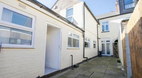 Bright and well-maintained front exterior of a ...