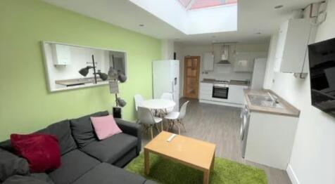Bright and modern open-plan living area featuri...