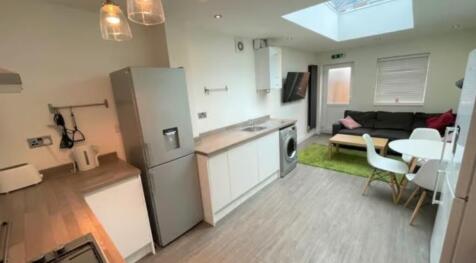 A modern and inviting living room with an open-...