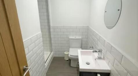 Bright and clean bathroom featuring a modern wh...