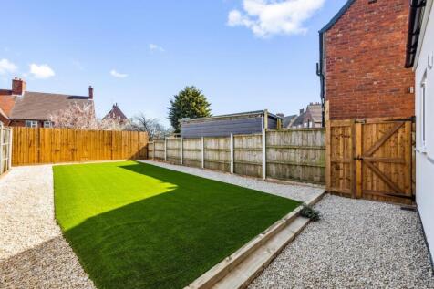 A beautifully maintained garden space featuring...