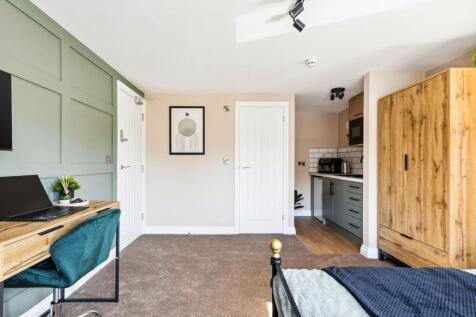 This charming double bedroom features a cozy la...