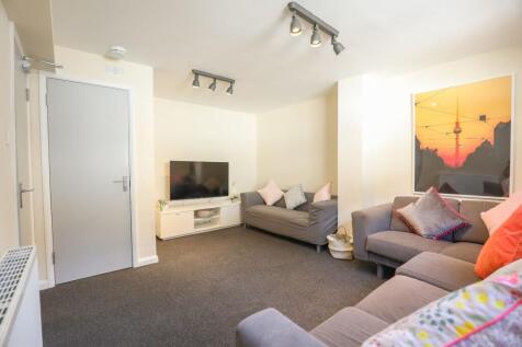 Bright and tidy living room featuring comfortab...