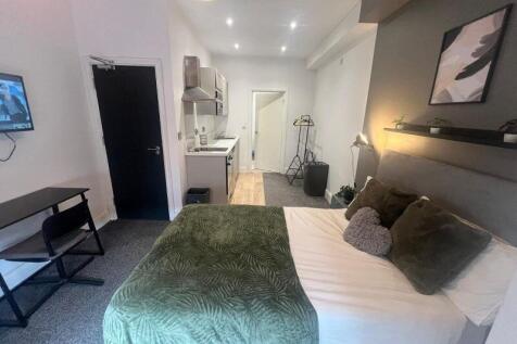 A stylish and well-maintained master bedroom fe...