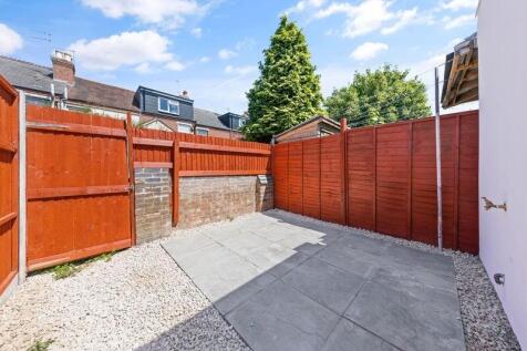 Bright and neatly maintained garden space featu...