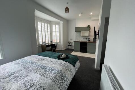 Bright and inviting double bedroom featuring a ...