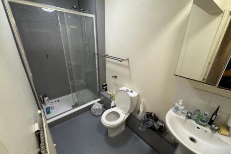 A well-equipped bathroom featuring a spacious s...
