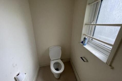A compact and functional single toilet area fea...