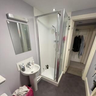 A clean and functional bathroom featuring a cor...