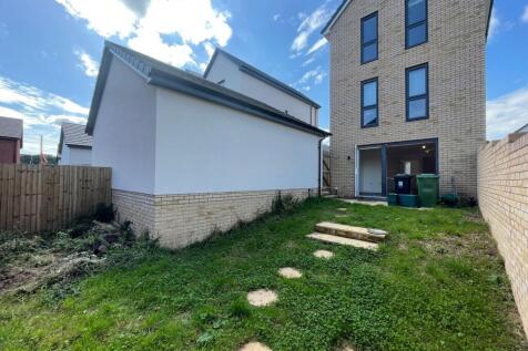 A private garden space featuring a grassy lawn ...
