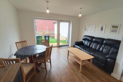 Bright and inviting living room featuring a com...