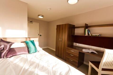 Bright and tidy double bedroom featuring a comf...