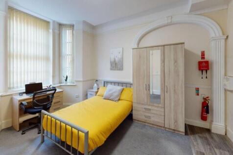 Bright and inviting single bedroom featuring a ...
